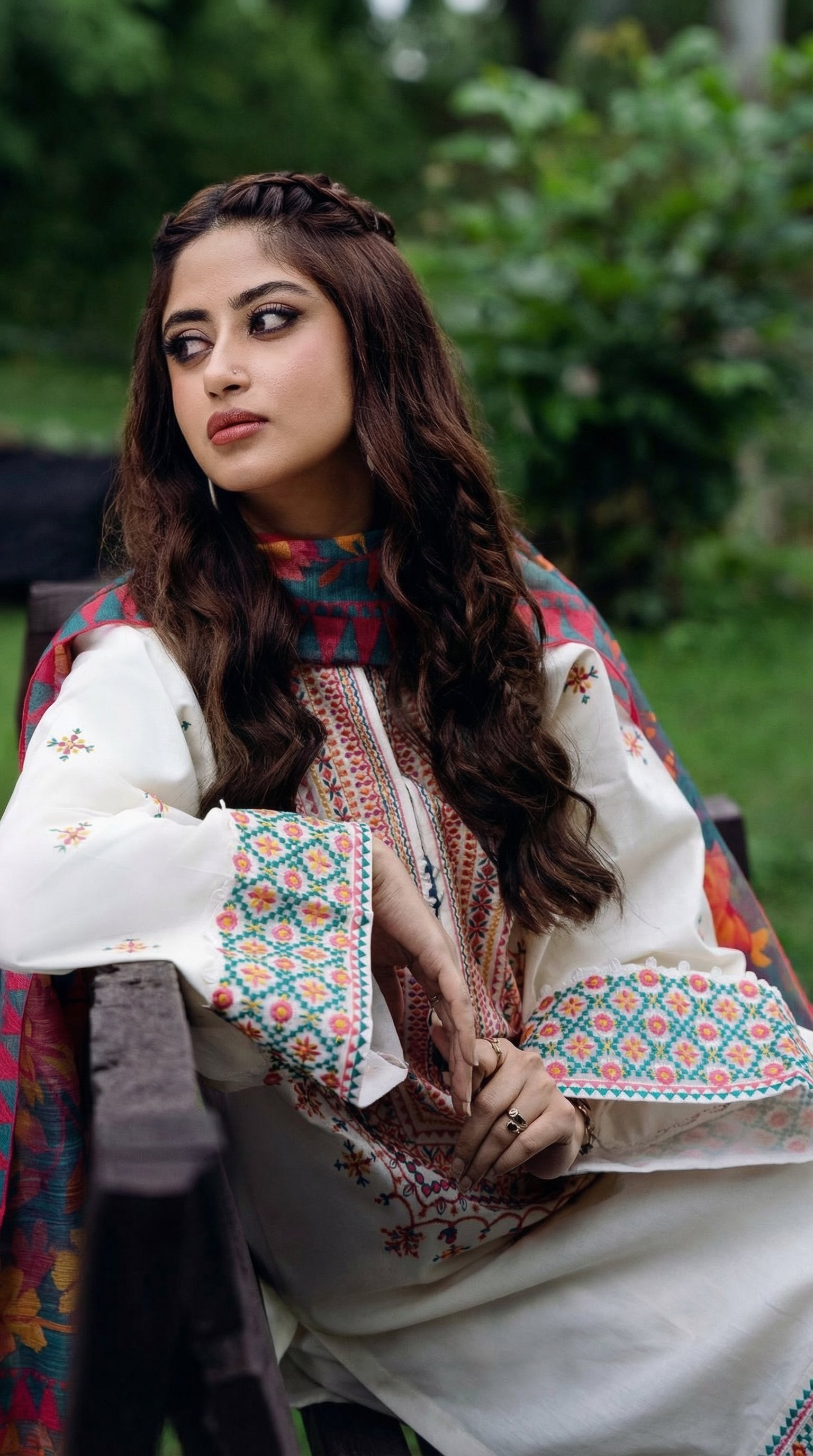 Model wearing hand-embroidered Oxybliss fabric outdoors